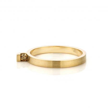 On the side, ring small with brown diamond
